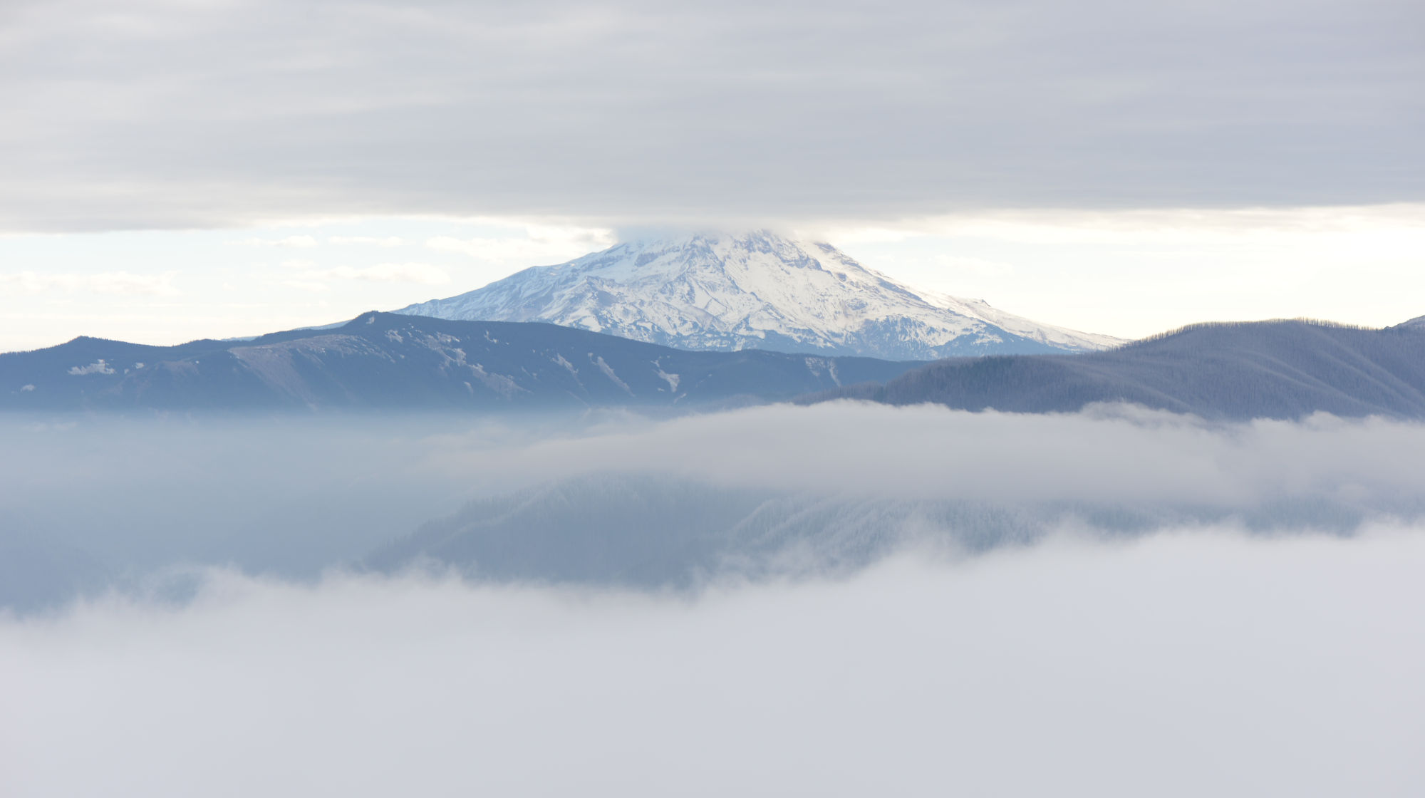 Mt. Hood in the distance in between cloud layers